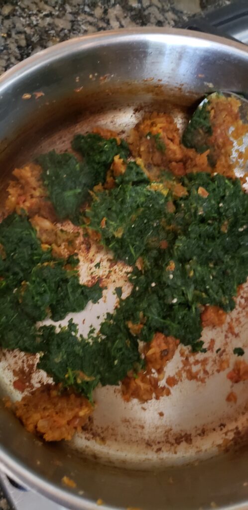 Add spices and spinach